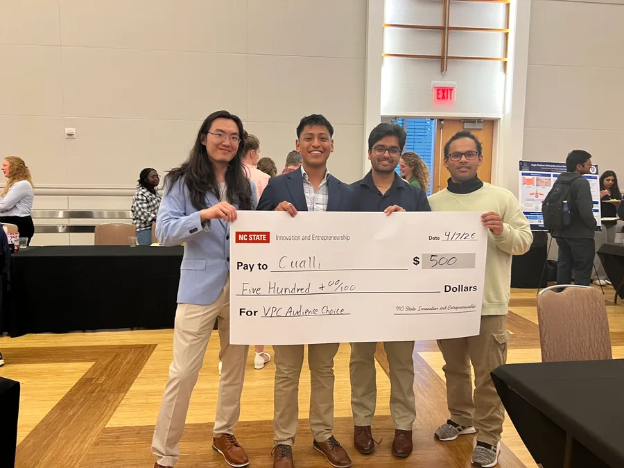 The Cualli team holding their $500 VenturePack Challenge Audience Choice prize check