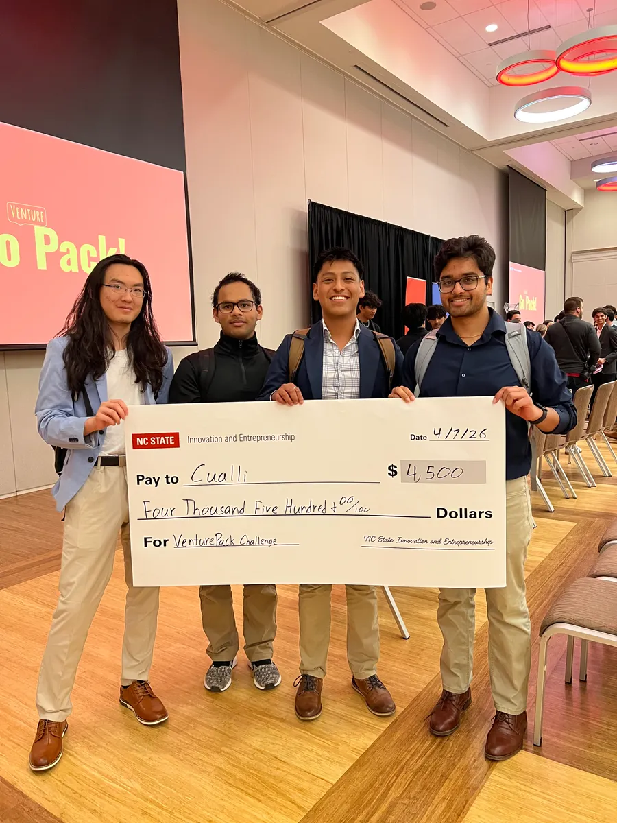The Cualli team holding their $4,500 VenturePack Challenge prize check